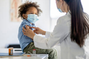 Boy Receiving a Vaccination During a Pandemic