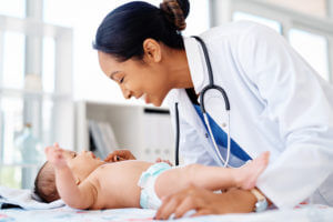 Pediatrcian checking Newborn baby